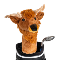 An elk-shaped golf club head cover sitting in a golf bag, with a club peeking out.
