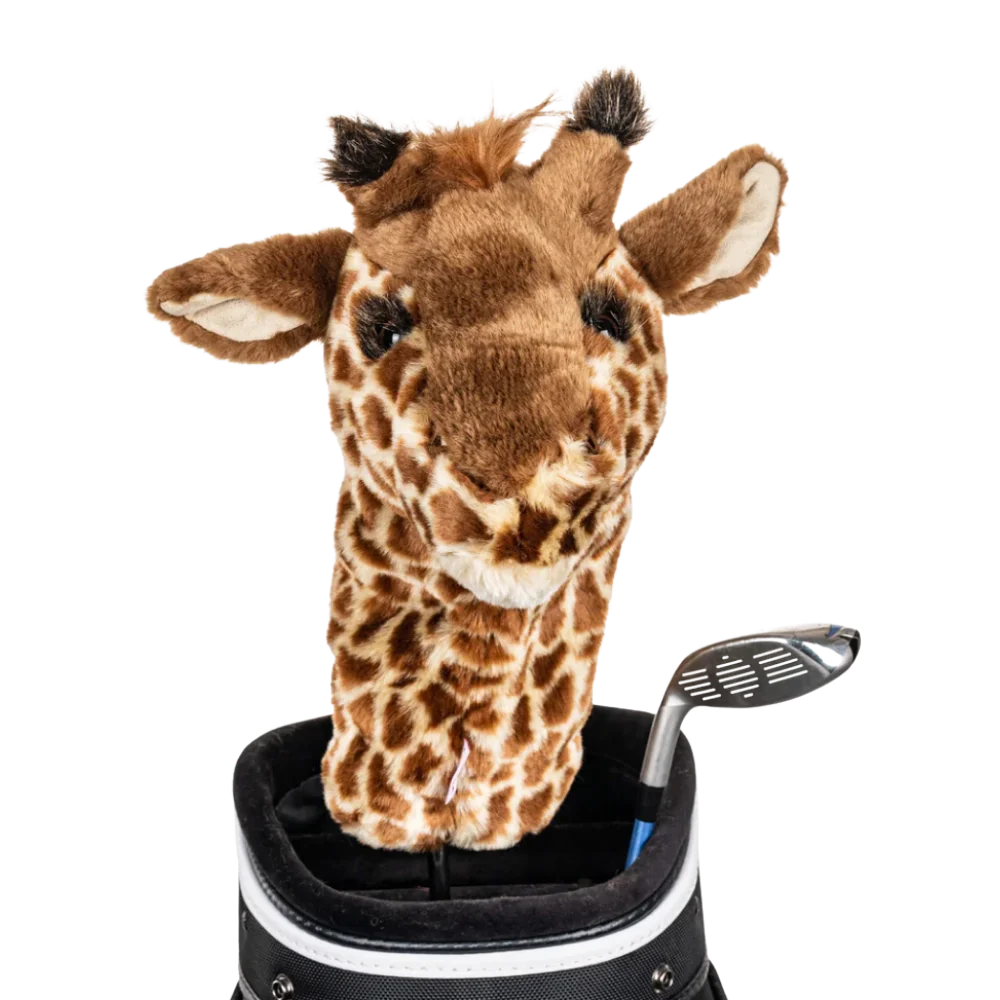 A giraffe-shaped golf club head cover sitting in a golf bag, with a club peeking out.