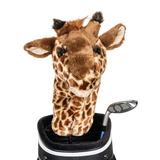 A giraffe-shaped golf club head cover sitting in a golf bag, with a club peeking out.
