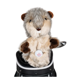 A gopher-shaped golf club head cover sitting in a golf bag, with a club peeking out.