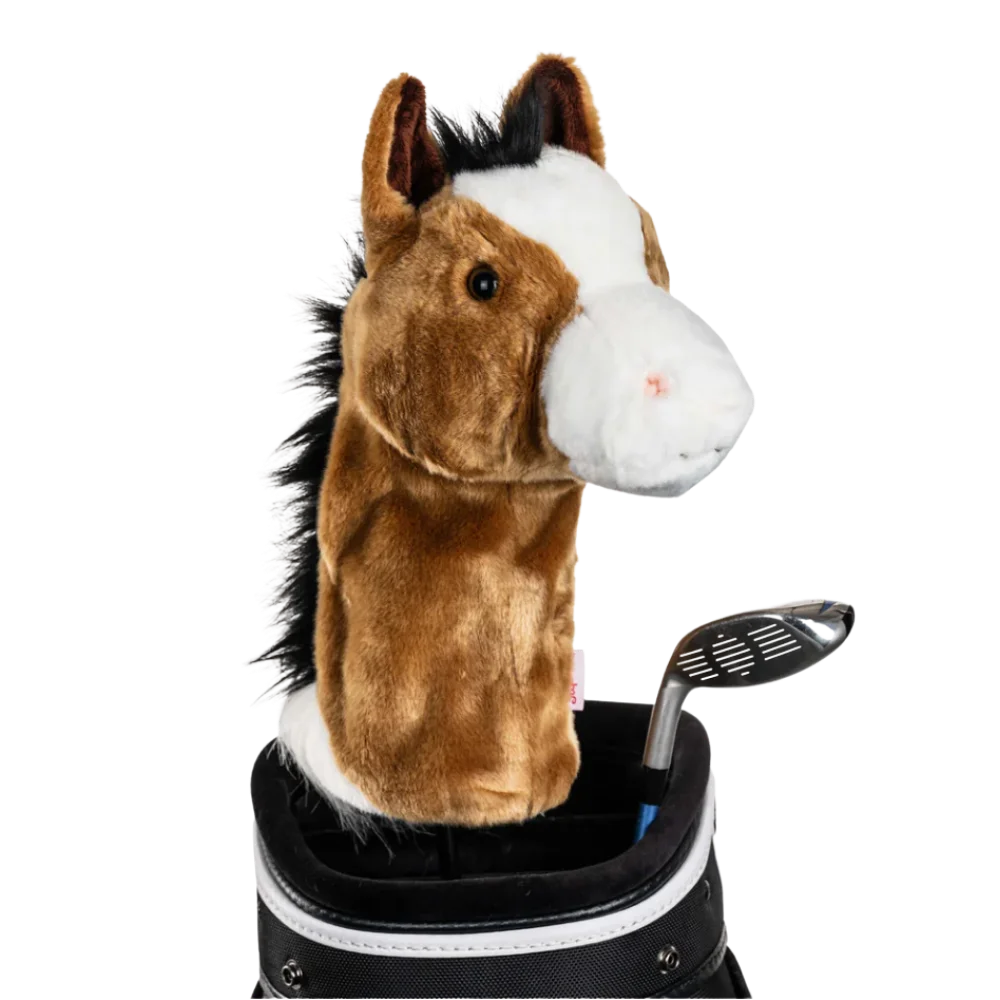 A horse-shaped golf club head cover sitting in a golf bag, with a club peeking out.