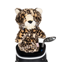 A leopard-shaped golf club head cover sitting in a golf bag, with a club peeking out.