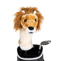 A lion-shaped golf club head cover sitting in a golf bag, with a club peeking out.