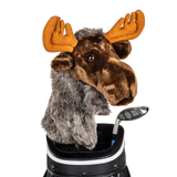 A moose-shaped golf club head cover sitting in a golf bag, with a club peeking out.