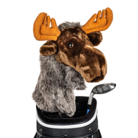 A moose-shaped golf club head cover sitting in a golf bag, with a club peeking out.