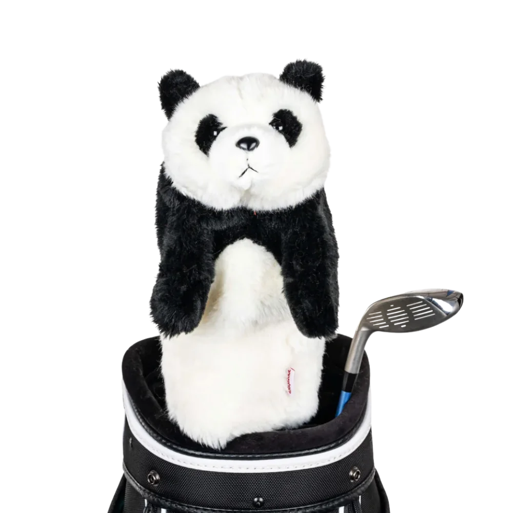 A panda-shaped golf club head cover sitting in a golf bag, with a club peeking out.