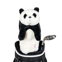 A panda-shaped golf club head cover sitting in a golf bag, with a club peeking out.