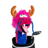 A pink dragon-shaped golf club head cover sitting in a golf bag, with a club peeking out.