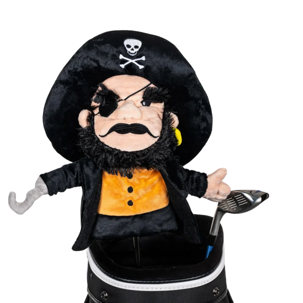 A pirate-shaped golf club head cover sitting in a golf bag, with a club peeking out.