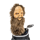 A Sasquatch-shaped golf club head cover sitting in a golf bag, with a club peeking out.