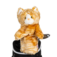 A tabby-shaped golf club head cover sitting in a golf bag, with a club peeking out.
