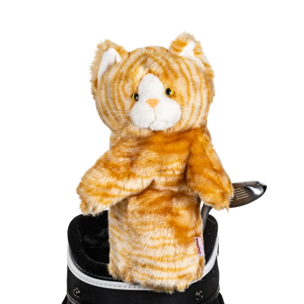 A tabby-shaped golf club head cover sitting in a golf bag, with a club peeking out.