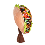 A plush golf head cover resembling a taco, featuring a colorful filling, including vegetables and sauce.