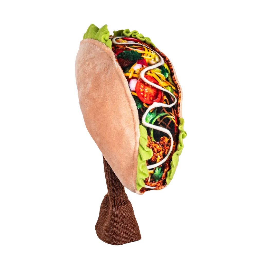 A plush golf head cover resembling a taco, featuring a colorful filling, including vegetables and sauce.