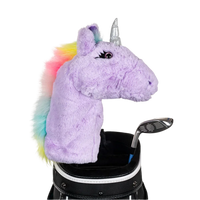 A unicorn-shaped golf club head cover sitting in a golf bag, with a club peeking out.