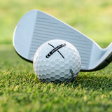 Golf club and golf ball on a grassy surface