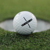 Golf ball with 'Distance' label on grass near a hole